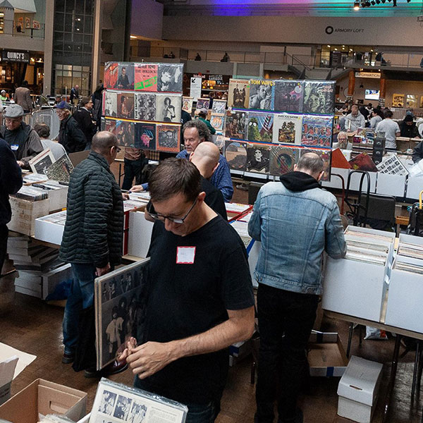 People browsing record collections