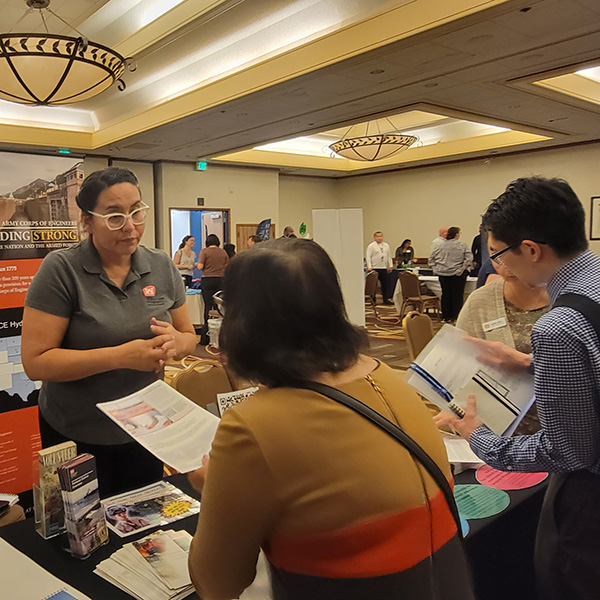 People gathered around a job vendor booth.