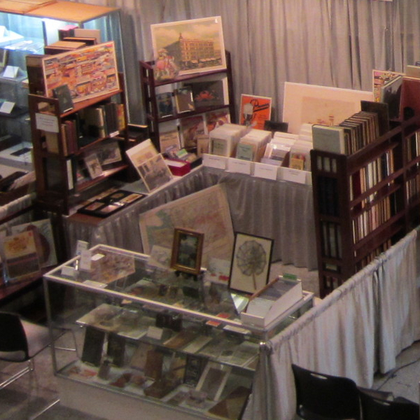 Aerial view of a book vendor filled with books in an exhibition hall.